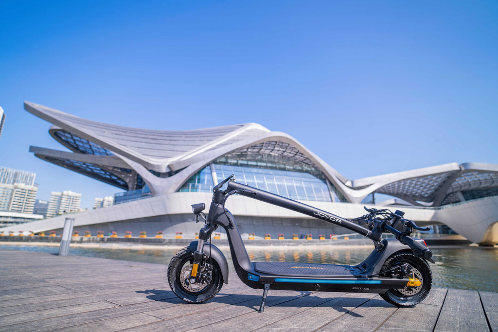 Electric scooter on a dock with modern architectural background